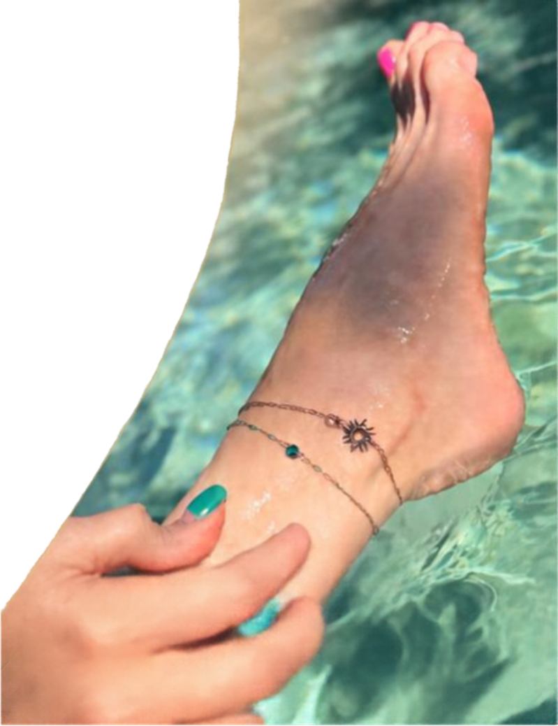 Permanent Jewelry Party Poster 2 - Steala LLC Fine Art Accessories Barefoot ankle with a delicate chain anklet featuring a sun charm, pink toenail polish, being adjusted by a hand by a swimming pool.